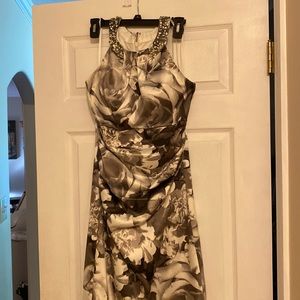 Formal dress. few jewels missing. Worn once. Ruching: front of the dress